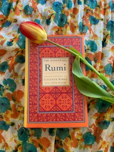 The Essential Rumi (book on floral background with a tulip)